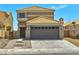 Two-story house with a two-car garage, concrete driveway, and tile roof at 1312 Pacific Terrace Dr, Las Vegas, NV 89128