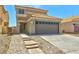 Two-story house with a two-car garage, concrete driveway, and tile roof at 1312 Pacific Terrace Dr, Las Vegas, NV 89128