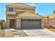 Two-story house with a two-car garage, concrete driveway, and tile roof at 1312 Pacific Terrace Dr, Las Vegas, NV 89128