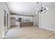 Open concept living area with modern kitchen, large island, and sliding doors to backyard at 1312 Pacific Terrace Dr, Las Vegas, NV 89128