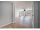 Spacious, naturally lit living room with baseboard trim, wood floors and modern ceiling fan at 1312 Pacific Terrace Dr, Las Vegas, NV 89128