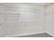 A walk-in closet features wood-look floors, white trim, and wire shelving at 1312 Pacific Terrace Dr, Las Vegas, NV 89128