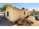 Home backyard with wood pile. Needs TLC at 136 Elm St, Henderson, NV 89015