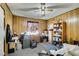 Bedroom features wood paneled walls, ceiling fan and lots of storage space at 136 Elm St, Henderson, NV 89015