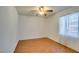 Bright bedroom features wood floors, ceiling fan, and natural light from window at 136 Elm St, Henderson, NV 89015