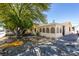 Charming home with a large tree and covered front porch at 136 Elm St, Henderson, NV 89015