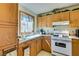 Cozy kitchen with updated appliances and ample cabinet space for storage at 136 Elm St, Henderson, NV 89015