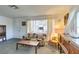 Inviting living room featuring large windows with natural light and vintage decor at 136 Elm St, Henderson, NV 89015