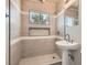 Bathroom featuring a stand-up shower with gray tile and a pedestal sink at 1404 Atlantic St, Las Vegas, NV 89104