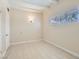 Bright bedroom with neutral walls, tile flooring, and a window at 1404 Atlantic St, Las Vegas, NV 89104