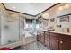 Elegant bathroom featuring double vanity, walk-in shower, soaking tub, and stylish mosaic tile at 1413 Miller Ridge Ave, North Las Vegas, NV 89031
