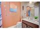 Charming bathroom features a wooden vanity with modern sink at 1413 Miller Ridge Ave, North Las Vegas, NV 89031