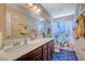 Bathroom featuring a large vanity with countertop space and plenty of cabinet storage at 1413 Miller Ridge Ave, North Las Vegas, NV 89031
