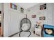 This bedroom has a hanging chair, decorative wall panels, a closet, and plenty of natural light at 1413 Miller Ridge Ave, North Las Vegas, NV 89031