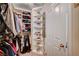 Walk-in closet offers custom shelving for storage of personal belongings at 1413 Miller Ridge Ave, North Las Vegas, NV 89031