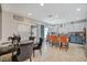 Open dining area offering a view into kitchen and elegant seating at 1413 Miller Ridge Ave, North Las Vegas, NV 89031