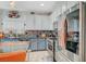Charming kitchen with stainless steel appliances, granite counters and mosaic backsplash at 1413 Miller Ridge Ave, North Las Vegas, NV 89031
