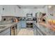 Updated kitchen featuring stainless appliances, sleek cabinetry, granite counters, and backsplash at 1413 Miller Ridge Ave, North Las Vegas, NV 89031