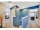 Upstairs landing featuring a blue accent wall that leads to the bedrooms at 1413 Miller Ridge Ave, North Las Vegas, NV 89031