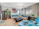 Stylish living room with plush sofas, chic decor, and lots of natural light from large windows, creating a welcoming space at 1413 Miller Ridge Ave, North Las Vegas, NV 89031