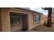 Home exterior featuring a tan stucco finish, red tile roof, and inviting front entrance at 1612 N Torrey Pines Dr # 104, Las Vegas, NV 89108