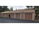 Row of private garages with tiled roofs, providing ample parking and storage space at 1612 N Torrey Pines Dr # 104, Las Vegas, NV 89108