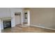 Spacious living room with hardwood floors, fireplace, and convenient washer/dryer access at 1612 N Torrey Pines Dr # 104, Las Vegas, NV 89108