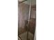 Nicely tiled shower with glass door featuring a built-in shelf for soaps and other essentials at 1612 N Torrey Pines Dr # 104, Las Vegas, NV 89108