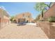 Expansive backyard featuring desert landscaping and patio area at 2057 Wandering Doe Ln, Las Vegas, NV 89134