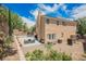 Large backyard with patio furniture, mature landscaping, and privacy fencing at 2057 Wandering Doe Ln, Las Vegas, NV 89134
