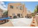 Spacious backyard featuring a concrete patio, grill, and trampoline for outdoor enjoyment at 2057 Wandering Doe Ln, Las Vegas, NV 89134