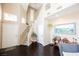 Elegant foyer with hardwood floors and high ceiling, creating a grand entrance at 2057 Wandering Doe Ln, Las Vegas, NV 89134