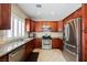 Well-equipped kitchen with stainless steel appliances, granite countertops, and ample cabinet space for storage at 2057 Wandering Doe Ln, Las Vegas, NV 89134