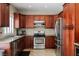 Well-equipped kitchen with stainless steel appliances, granite countertops, and ample cabinet space for storage at 2057 Wandering Doe Ln, Las Vegas, NV 89134