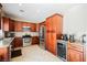 Well-equipped kitchen with stainless steel appliances, granite countertops, and ample cabinet space for storage at 2057 Wandering Doe Ln, Las Vegas, NV 89134