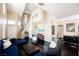 Spacious living room featuring high ceilings, dark wood floors, and an open floor plan perfect for entertaining at 2057 Wandering Doe Ln, Las Vegas, NV 89134