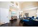 Bright living room with hardwood floors, high ceiling, and natural light, perfect for relaxing and entertaining at 2057 Wandering Doe Ln, Las Vegas, NV 89134