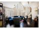 Bright living room boasts a high ceiling and hardwood floors at 2057 Wandering Doe Ln, Las Vegas, NV 89134