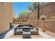 Cozy backyard patio area with outdoor seating, perfect for relaxing and entertaining guests at 2057 Wandering Doe Ln, Las Vegas, NV 89134