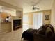 Inviting living room featuring tile flooring, a ceiling fan, and sliding glass doors for natural light at 23 E Agate Ave # 403, Las Vegas, NV 89123