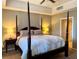 Relaxing main bedroom with a four-poster bed, ceiling fan, and neutral walls for a serene atmosphere at 23 E Agate Ave # 403, Las Vegas, NV 89123
