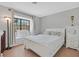 Comfortable bedroom featuring a window seat, dresser, and wood floors at 2699 Aldonza Dr, Henderson, NV 89014