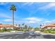Well maintained community featuring lush landscaping, mature trees, and guarded entrance at 2699 Aldonza Dr, Henderson, NV 89014