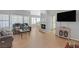 Inviting living area boasting hardwood floors, stone fireplace, and large windows at 2699 Aldonza Dr, Henderson, NV 89014