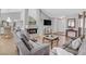 Bright living room showcasing a stone fireplace, hardwood floors, and open floorplan at 2699 Aldonza Dr, Henderson, NV 89014