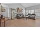 Spacious living room with hardwood floors, display case, and comfortable seating at 2699 Aldonza Dr, Henderson, NV 89014