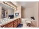 Relaxing bathroom features a soaking tub, double sinks, and tiled accents at 2708 Campo Verde Dr, Las Vegas, NV 89121