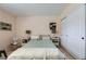 This bedroom features tile flooring and sliding closet doors at 2708 Campo Verde Dr, Las Vegas, NV 89121