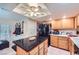 Functional kitchen equipped with a center island, tile floors, and modern appliances at 2708 Campo Verde Dr, Las Vegas, NV 89121