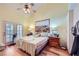 Bright main bedroom includes vaulted ceilings, wood floors, and outdoor access at 2708 Campo Verde Dr, Las Vegas, NV 89121